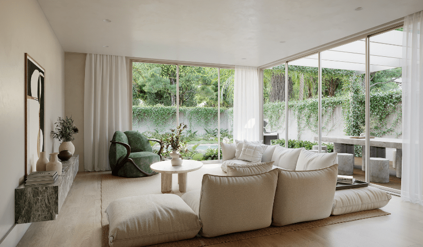 A serene, minimalist living room with a low white sofa and a sculptural green armchair, looking out through large glass doors to a private walled garden. Detailed interiors are crucial for immersive 3d animation real estate.