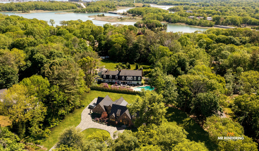 An aerial view showing two large estates nestled within dense green forest near an intricate coastline, demonstrating photomontage architecture.