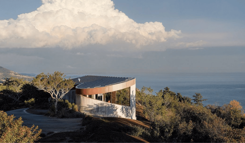 Modern hillside house by architectural rendering companies with realistic exterior sunset visualization.