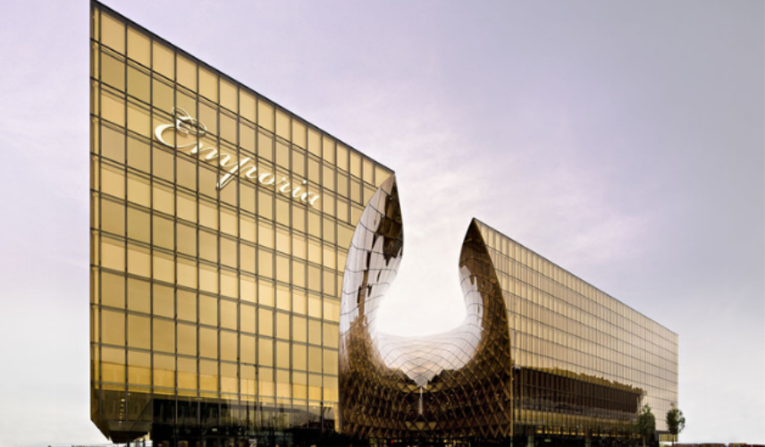 Emporia shopping center featuring curved golden Glass Facade Architecture with reflective glazing in Malmö, Sweden